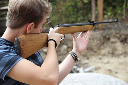 man aiming hunting rifle thumbnail