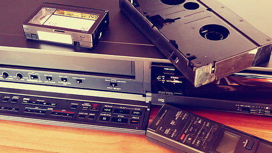 black VHS player with VHS tape thumbnail