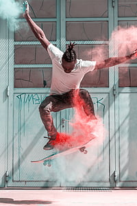 person wearing white crew-neck t-shirt flipping skateboard on air thumbnail