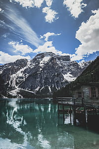 beige wooden house on body of water thumbnail