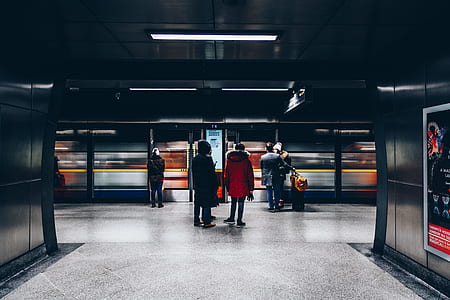 people standing on train station thumbnail