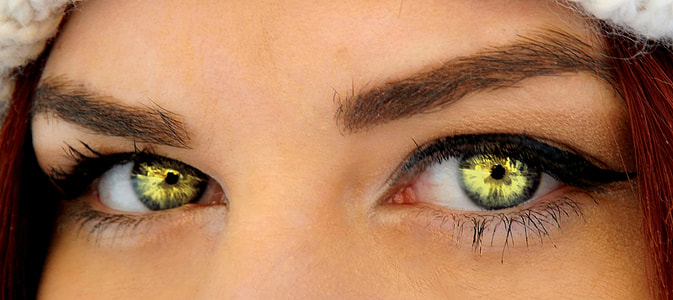 woman wearing green contact lens in closeup photography thumbnail