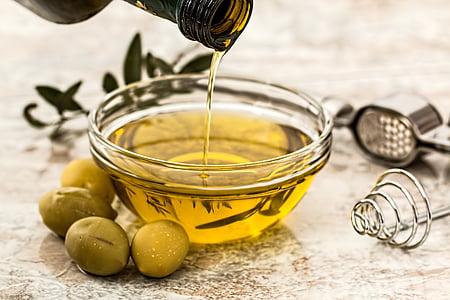 round clear glass bowl with olive oil thumbnail