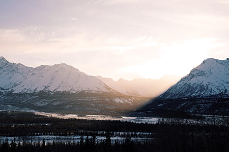 snow covered mountain during sunset thumbnail