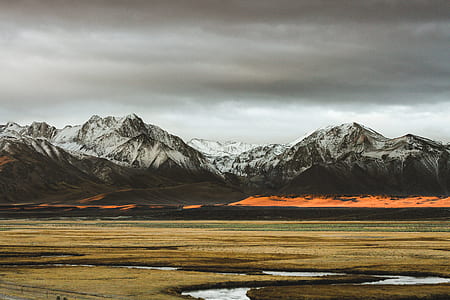 landscape photo of steppe with mountain background thumbnail