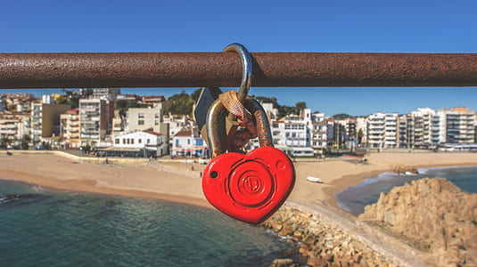 red and grey heart padlock on brown bar thumbnail