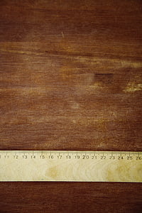 beige ruler on brown wooden surface thumbnail