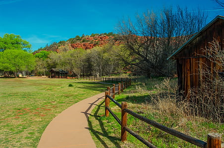 brown wooden fence along pathway thumbnail