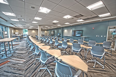 empty room with tables and chairs thumbnail