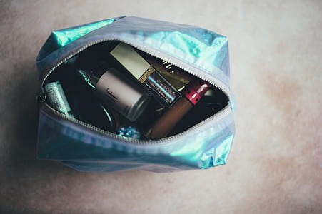 glass bottles in blue purse thumbnail