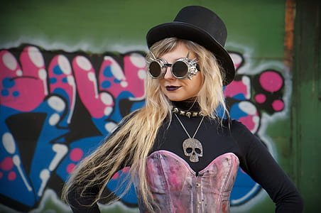 girl wearing black bucket hat and black-and-pink long-sleeved shirt thumbnail