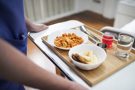person holding tray of foods thumbnail