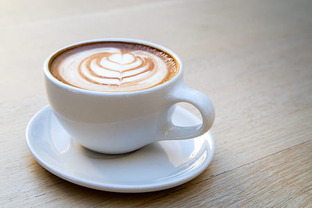 white ceramic tea cup on plate thumbnail