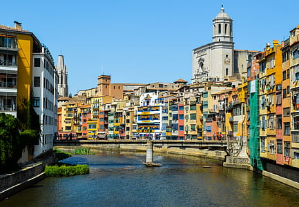 calm body of water between buildings thumbnail