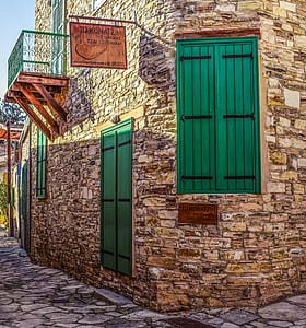 closed green wooden doors and windows thumbnail