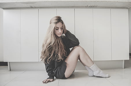 woman on black top standing on white floor thumbnail