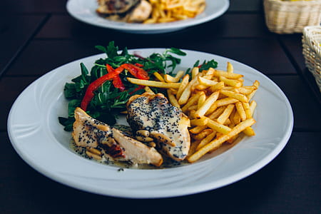 chicken, French fries, and salad on plate thumbnail