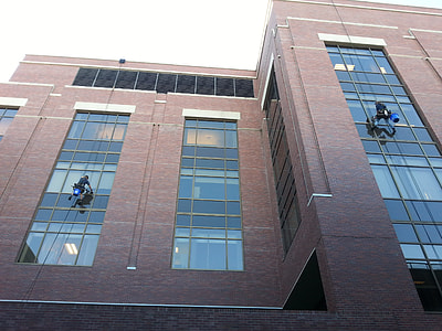 low angle photo of two person hanging on building thumbnail