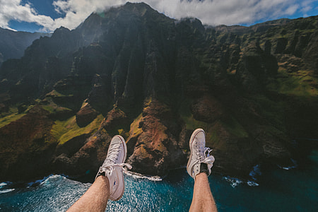 photo of person wearing white sneakers thumbnail