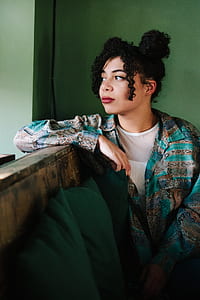 woman sitting on brown wooden bench thumbnail