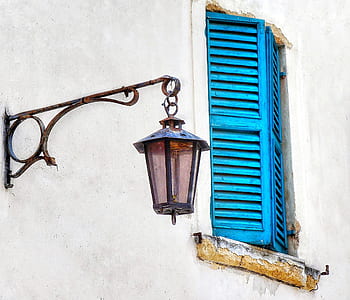 black glass lantern mounted on wall outside house thumbnail