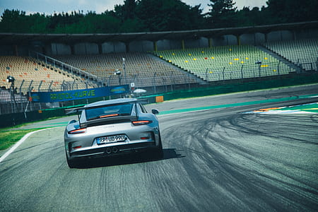 silver car on road at daytime thumbnail