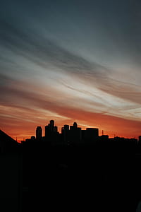silhouette of city building during dawn thumbnail