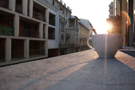 white ceramic cup on gray concrete surface thumbnail