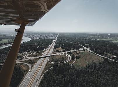 aerial photography of road and river under gray sky thumbnail