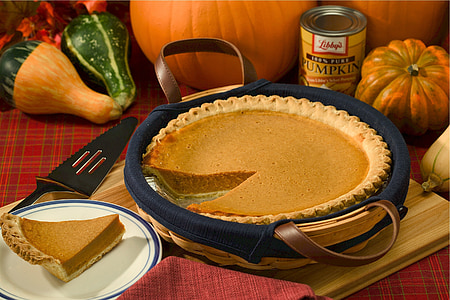 sliced of pumpkin pie in brown wicker basket thumbnail