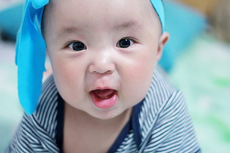 baby wearing white and black striped onesie thumbnail