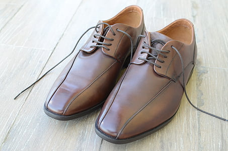 pair of brown leather dress shoes thumbnail