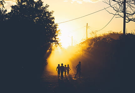 group of children running during golden hour thumbnail