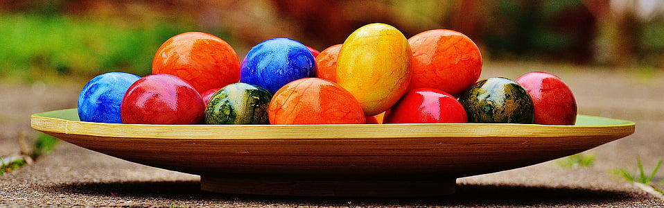 assorted-color decorative eggs on tray thumbnail