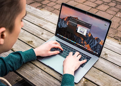 person typing on MacBook Pro keyboard thumbnail