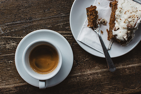 Espresso with carrot cake at a wooden table thumbnail