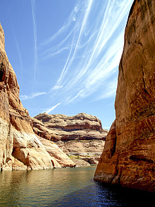 low-angle photography of body of water in the middle of cliffs thumbnail