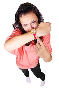 woman wearing pink top and pointing her watch thumbnail