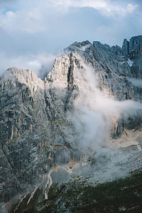 rocky mountains covered with white clouds thumbnail