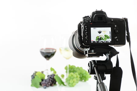 red and white grapes beside wine glasses filled with wines thumbnail
