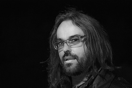 man wearing silver framed eyeglasses thumbnail