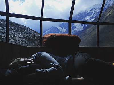 woman lying beside window thumbnail