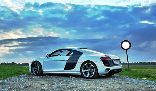 silver Audi R8 pakred on rough road during daytime thumbnail