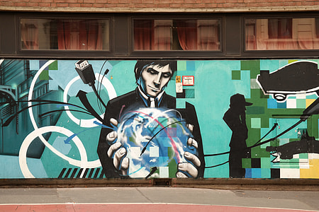 man holding globe wall painting thumbnail