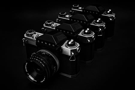 grayscale photo of four point-and-shoot cameras thumbnail