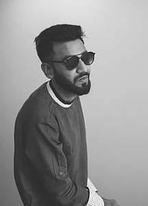 Monochrome Photography of Man Wearing Sunglasses thumbnail