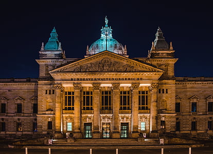 brown concrete building at nighttime thumbnail