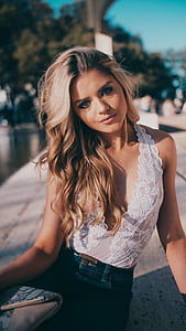 woman posing while sitting photo thumbnail