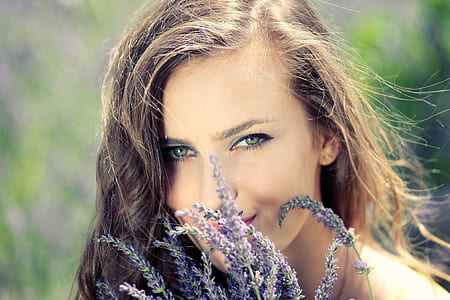 purple lavender infront of woman face thumbnail