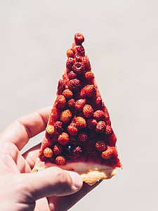 person holding pizza with raspberries thumbnail